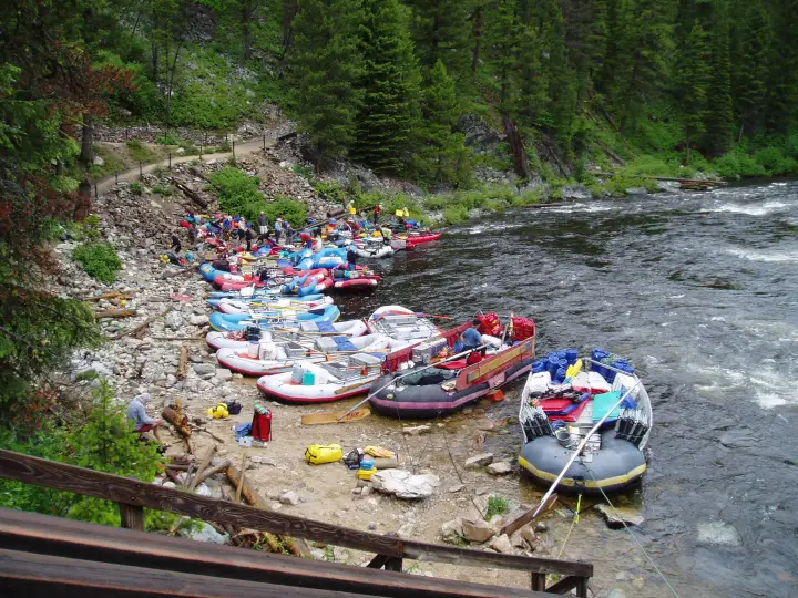 Rafts and gear staged on the bank at the Boundary Creek launch